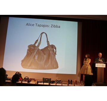 Presenter Lincoln Moore of Saks Fifth Avenue announcing the Winner of the Best Handbag in Overall Style and Design, Alice Tapajos for Zibba