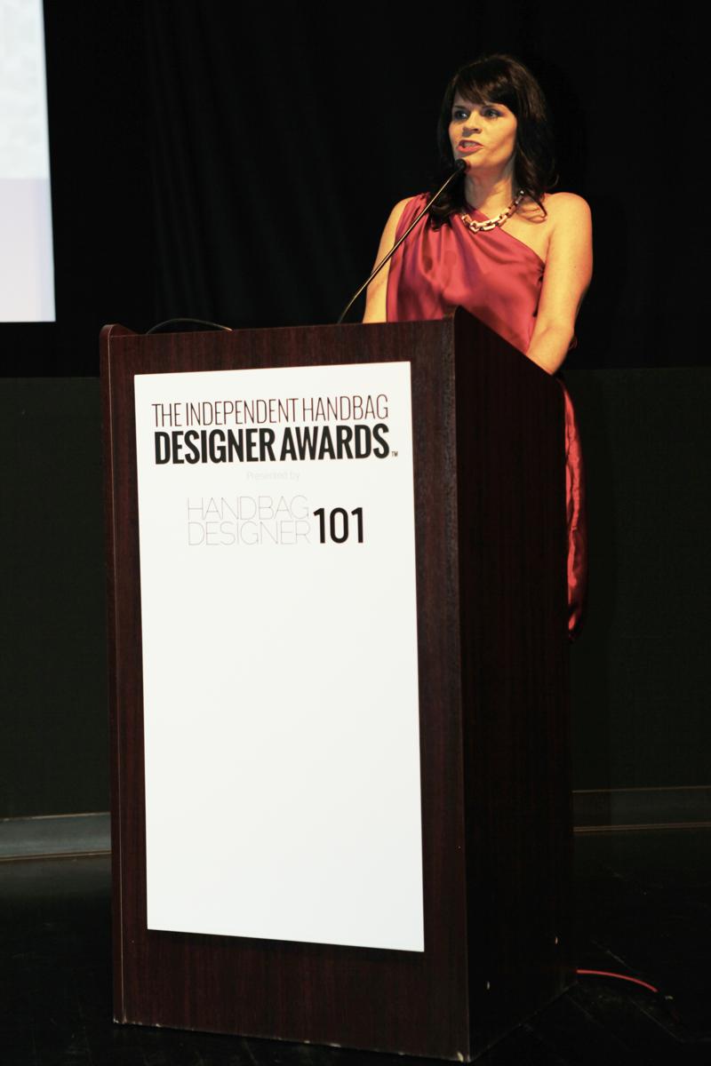 Roxanne Robinson, WWD, presenting the 2014 IHDA ICONOCLAST Recipient, Monica Botkier