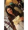 Judge and Presenter, Christina Polychroni of Korres Natural Products with the Winning Envelope for Best Green Handbag created by Leather Suede Skins